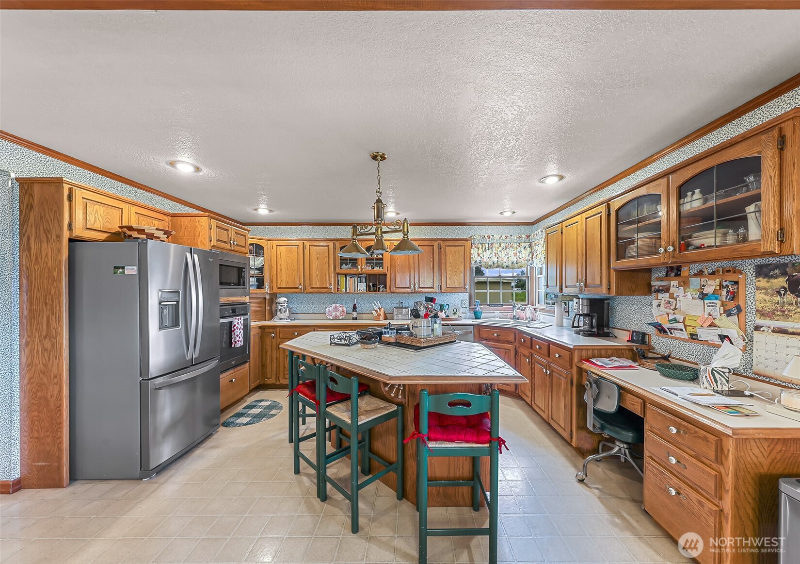 8634 Double Ditch Road Lynden, WA 98264 - Photo 5 of 40 a kitchen with stainless steel appliances granite countertop a sink stove and refrigerator