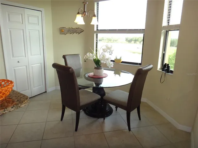 a dining room with furniture and window