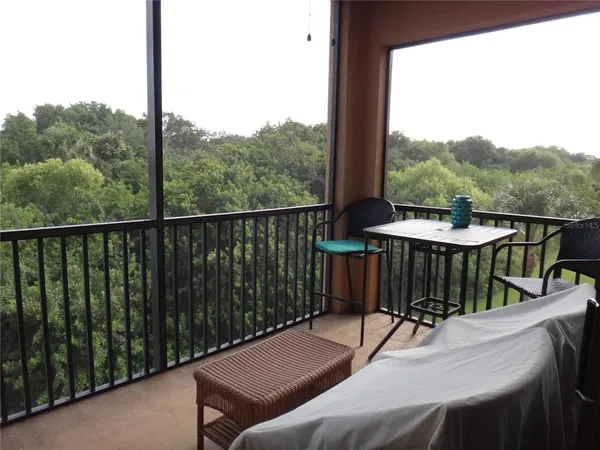 a view of a balcony with furniture