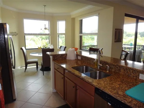 a kitchen with granite countertop a sink and a counter