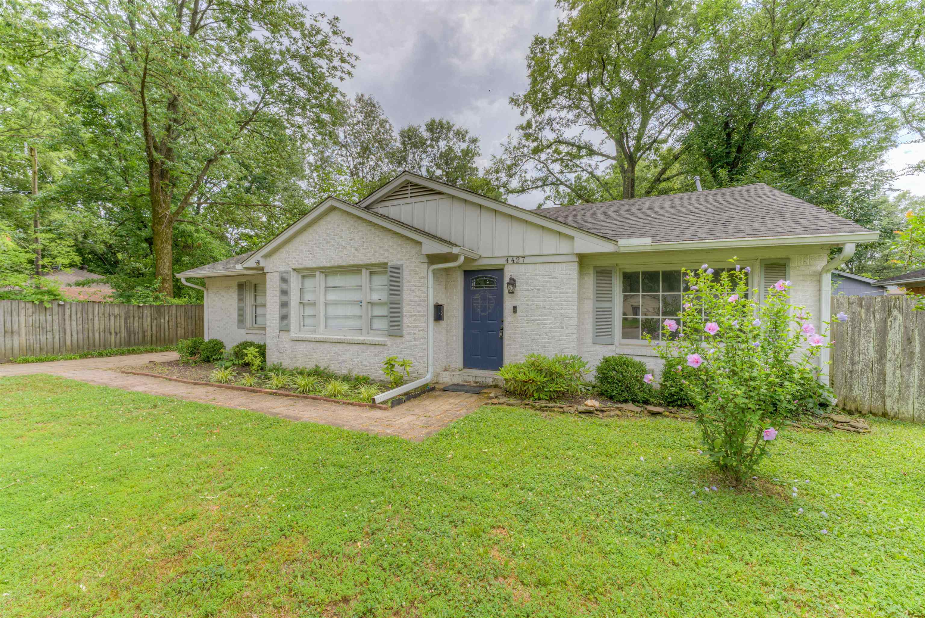 4427 Quince Road Memphis, TN 38117 - Photo 1 of 26 a view of a house with a yard and plants