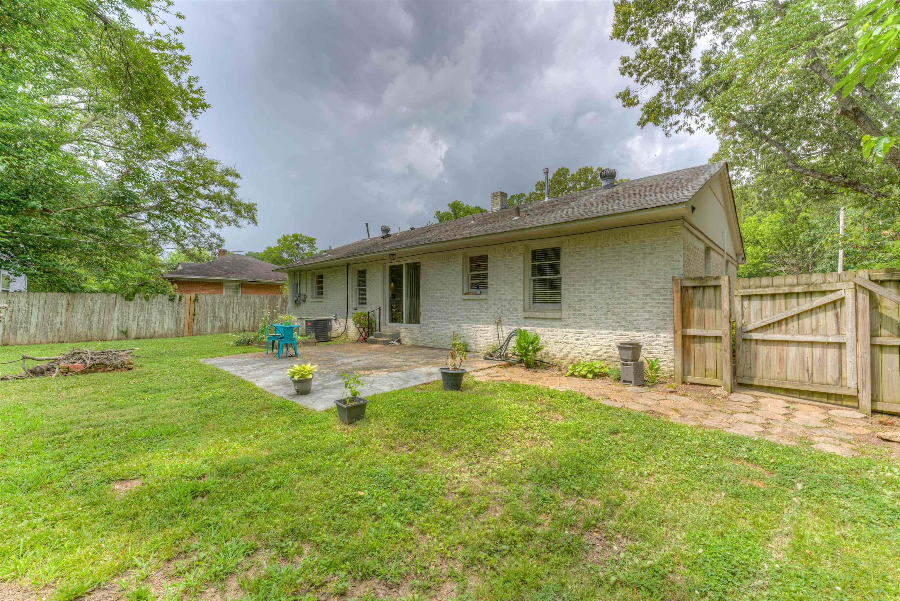 4427 Quince Road Memphis, TN 38117 - Photo 5 of 26 a view of a house with a yard and sitting area