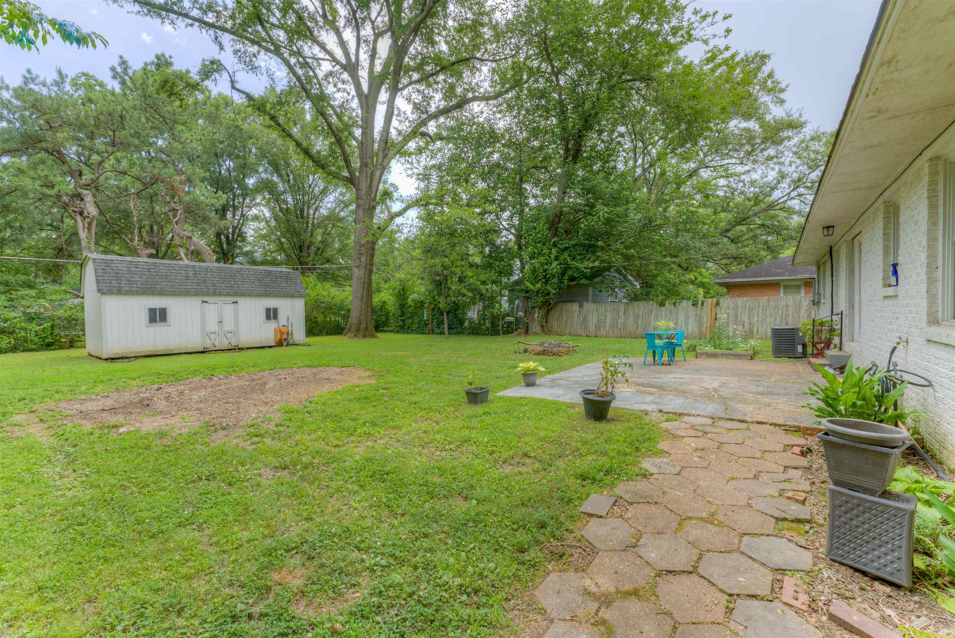 4427 Quince Road Memphis, TN 38117 - Photo 6 of 26 a view of a garden with a bench