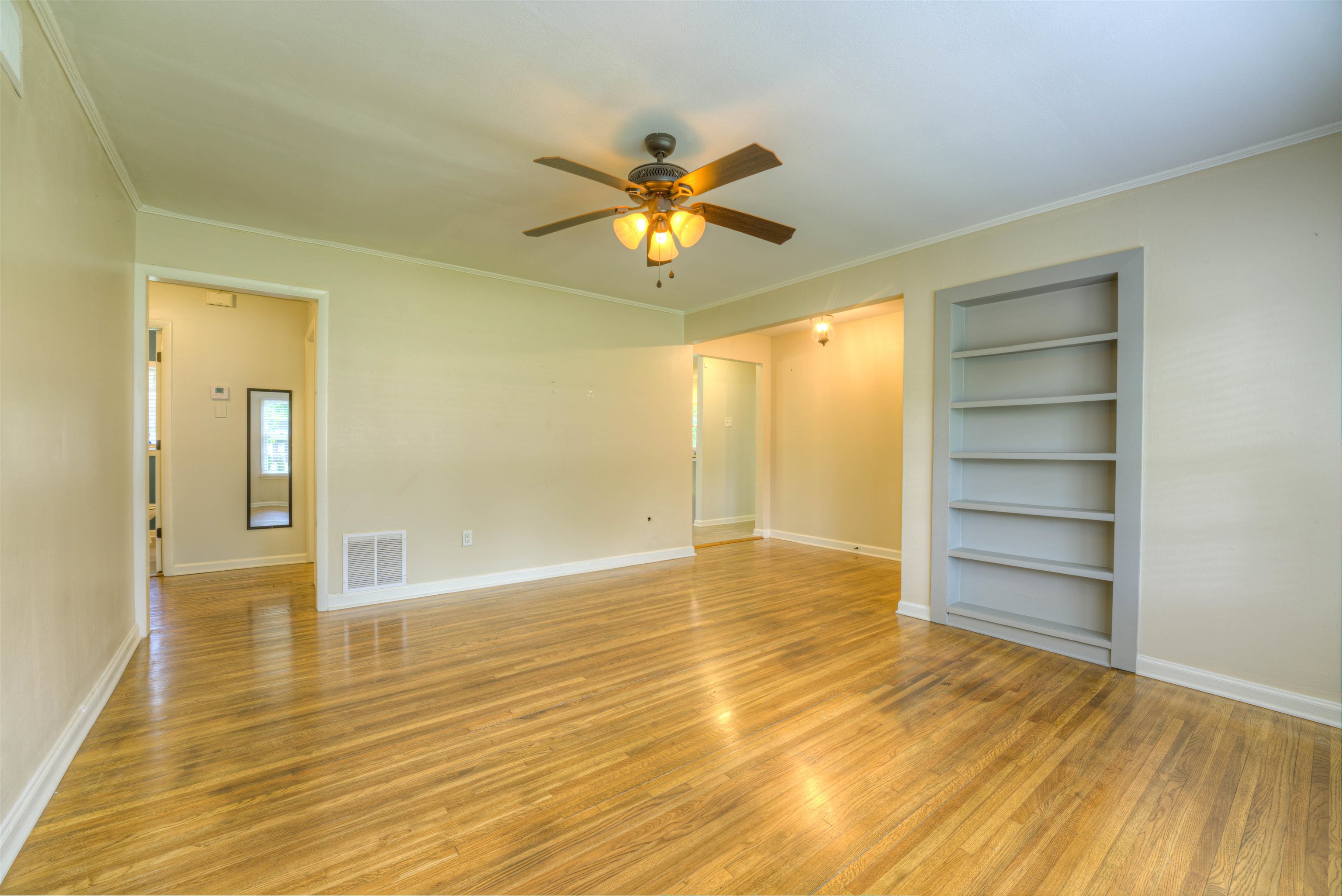 4427 Quince Road Memphis, TN 38117 - Photo 9 of 26 a view of room with a ceiling fan a hardwood floor and a ceiling fan