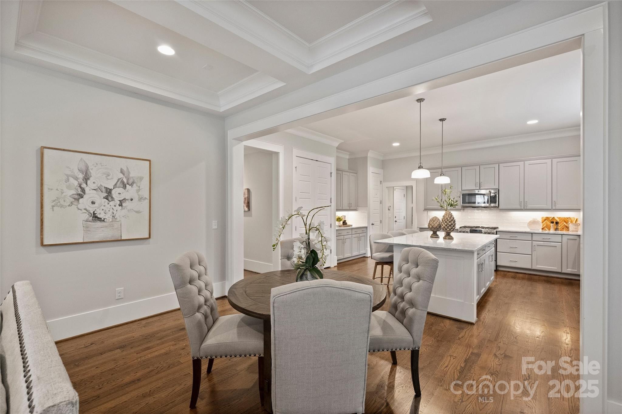 1550 Matthew McClure Circle Davidson, NC 28036 - Photo 12 of 38 a view of a dining room with furniture and wooden floor