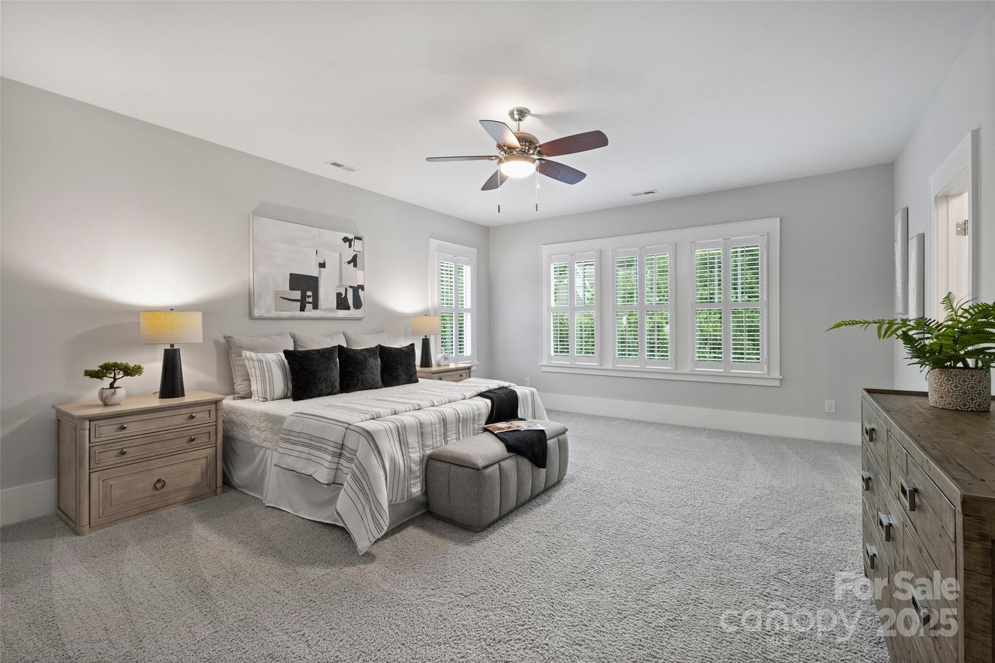 1550 Matthew McClure Circle Davidson, NC 28036 - Photo 23 of 38 a bedroom with a bed and a chandelier