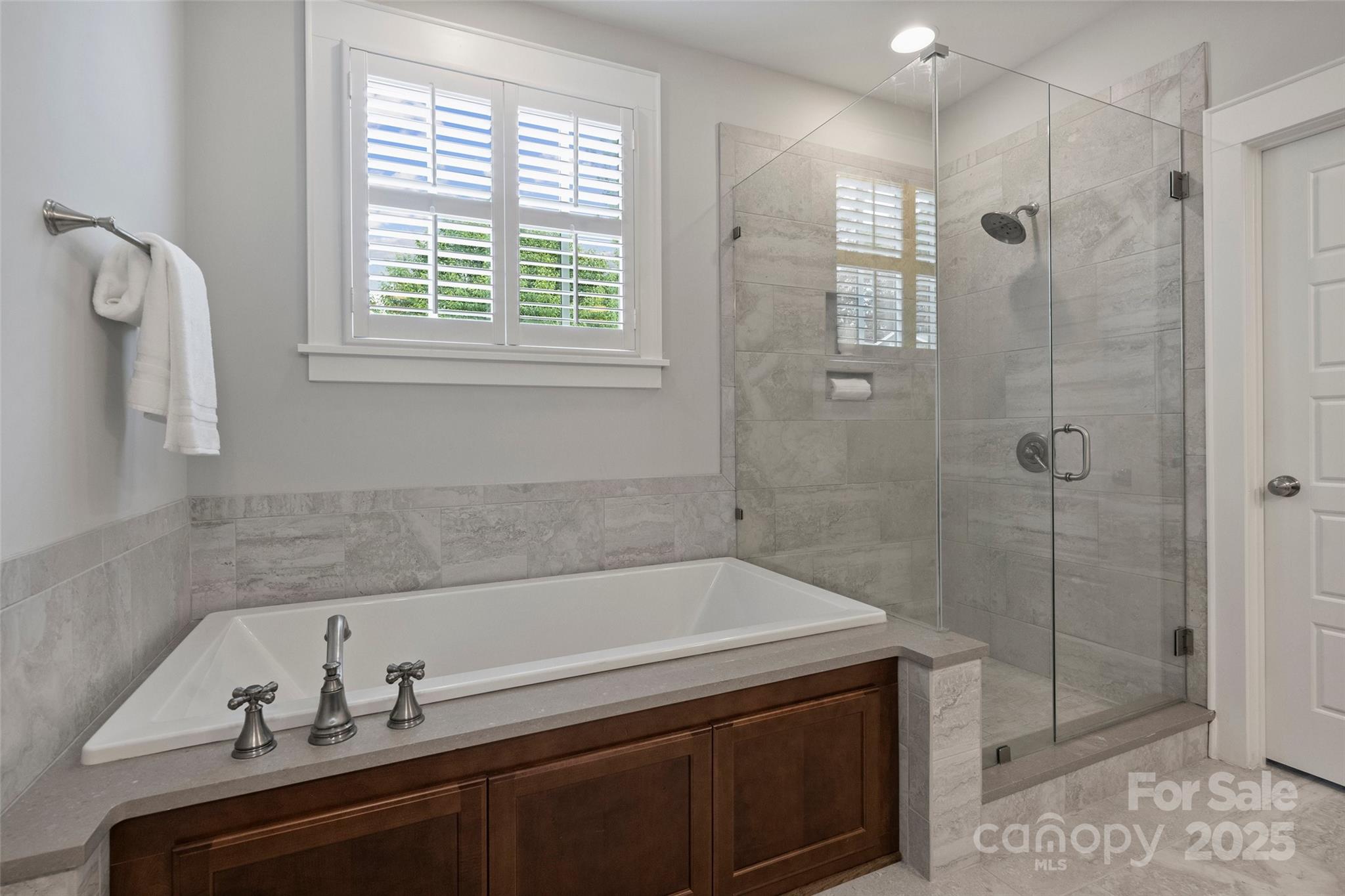 1550 Matthew McClure Circle Davidson, NC 28036 - Photo 25 of 38 a bathroom with a bathtub and shower