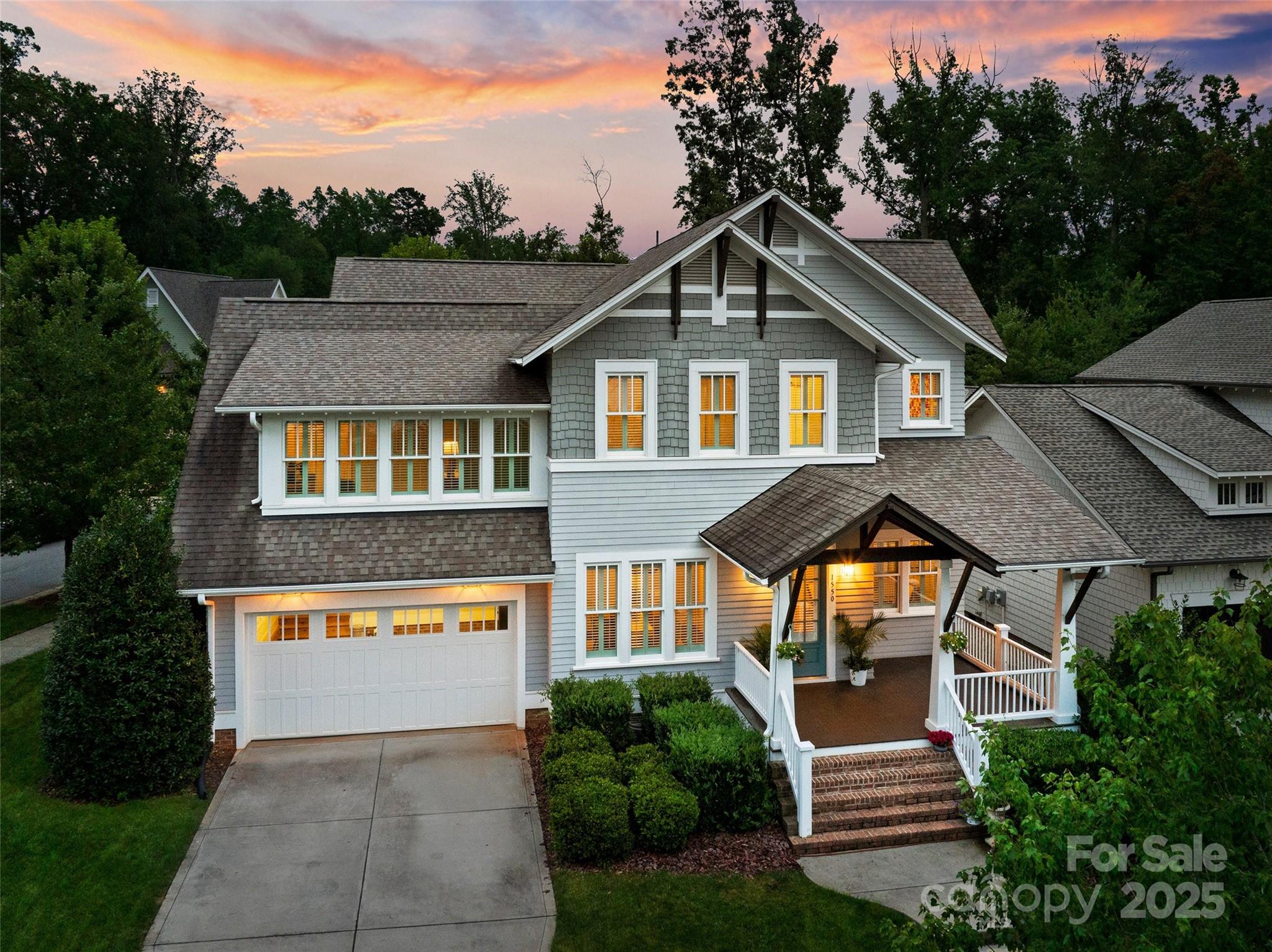 1550 Matthew McClure Circle Davidson, NC 28036 - Photo 35 of 38 a front view of a house with a yard and garage