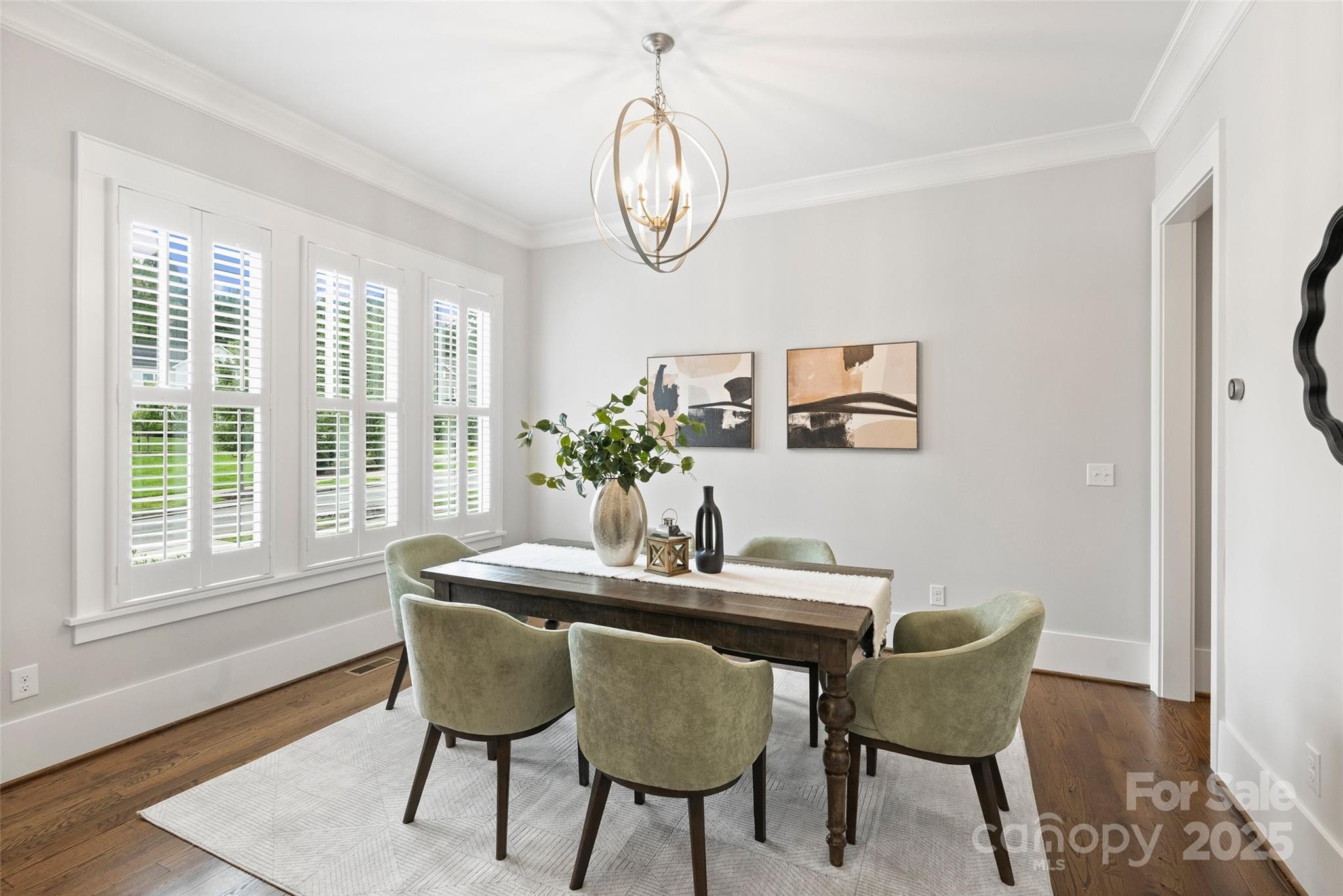 1550 Matthew McClure Circle Davidson, NC 28036 - Photo 5 of 38 a dining room with furniture a rug and wooden floor