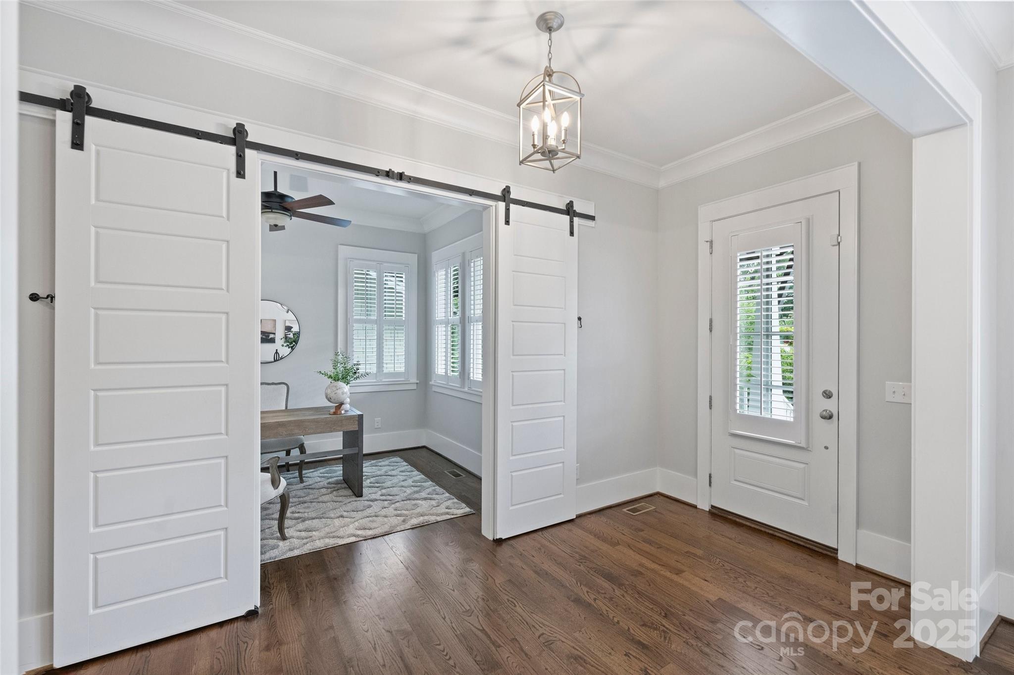 1550 Matthew McClure Circle Davidson, NC 28036 - Photo 7 of 38 a view of a livingroom with wooden floor staircase and a bathroom
