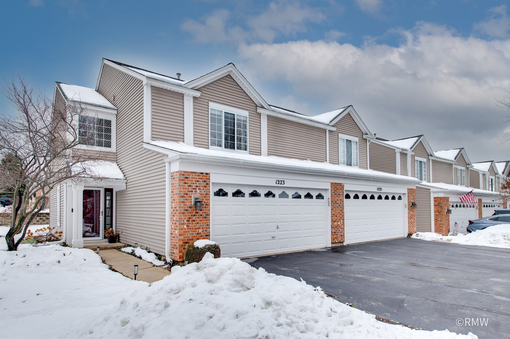 a front view of a building with a yard