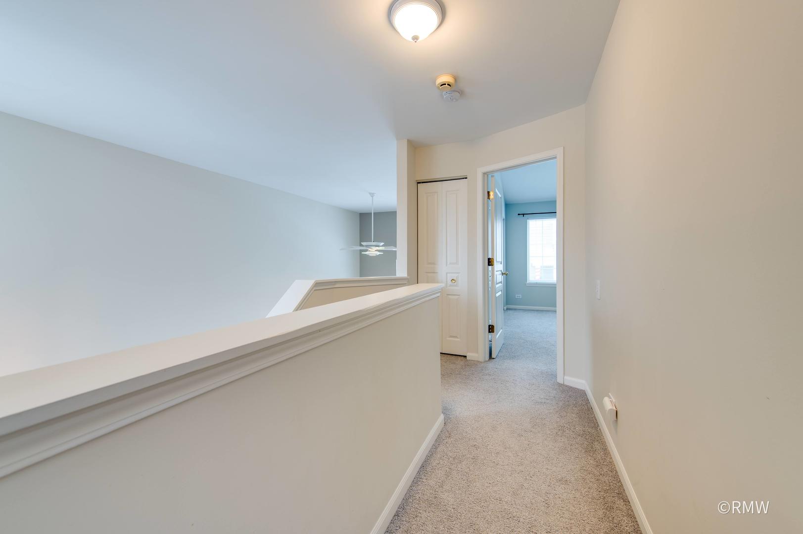 1223 Summersweet Lane Bartlett, IL 60103 - Photo 11 of 22 a view of a hallway with bathroom