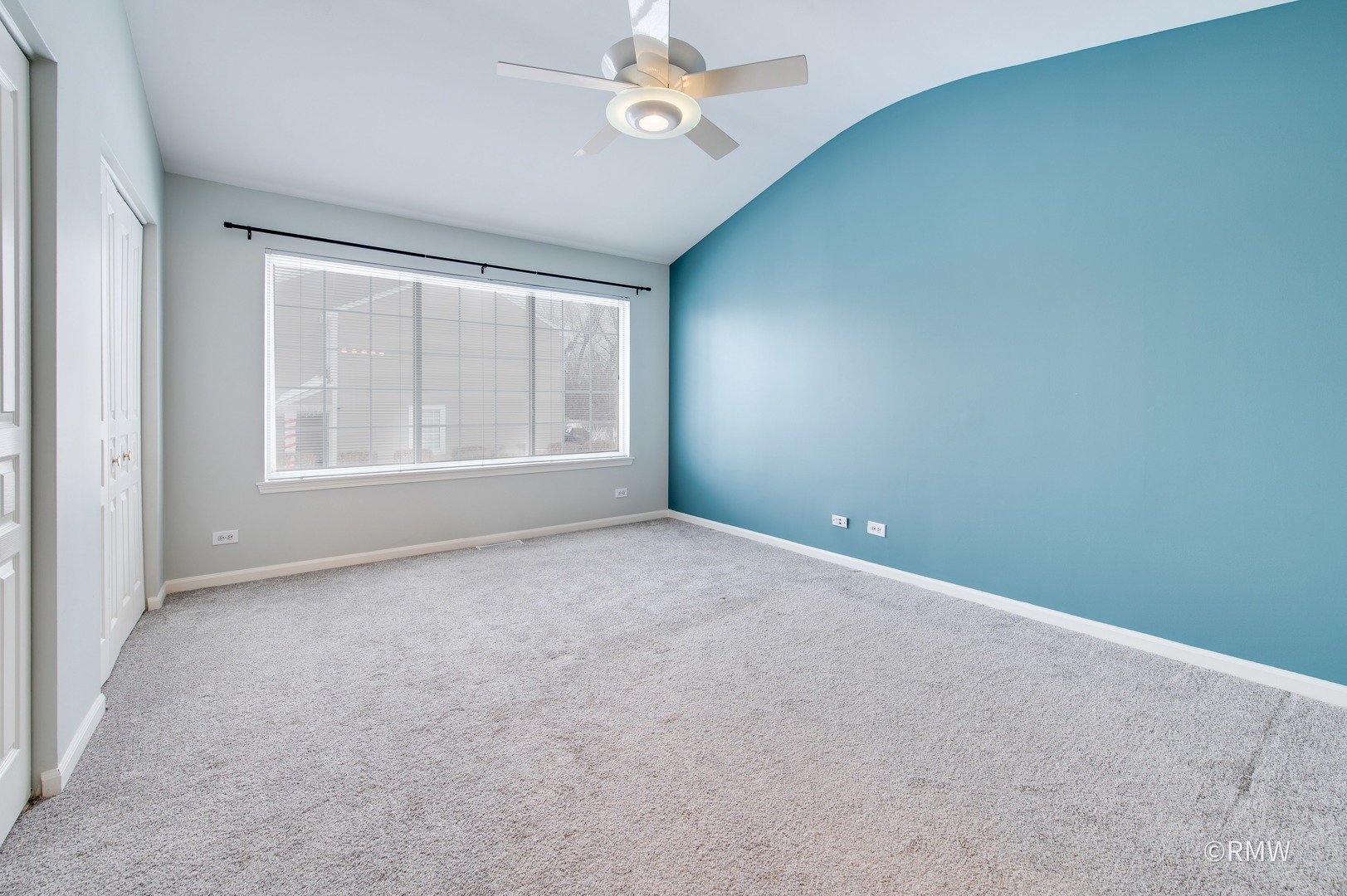 1223 Summersweet Lane Bartlett, IL 60103 - Photo 12 of 22 an empty room with windows and ceiling fan