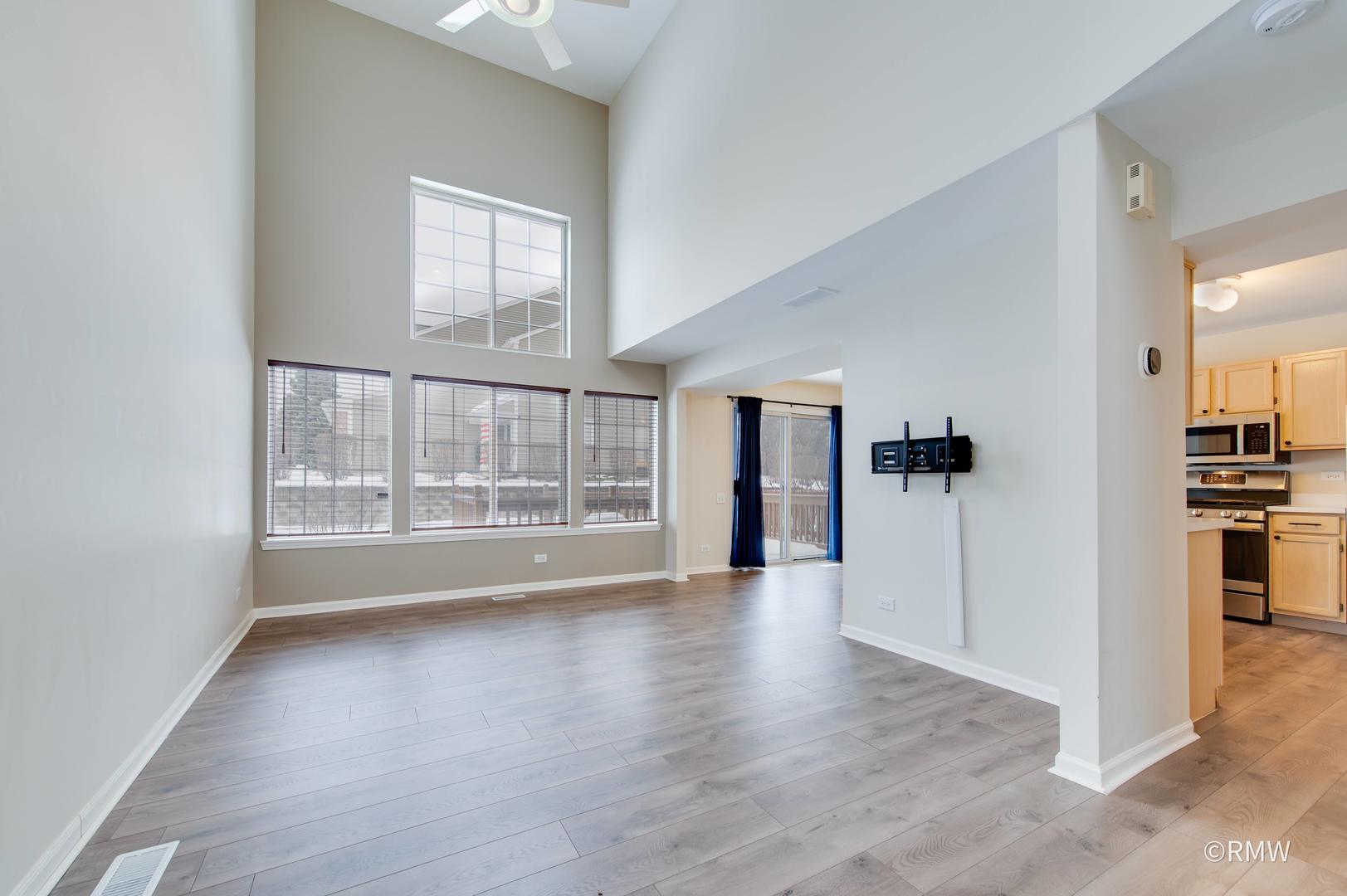 1223 Summersweet Lane Bartlett, IL 60103 - Photo 3 of 22 wooden floor in an empty room with a window