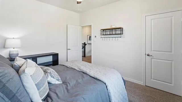 a bedroom with a bed and a view of bathroom