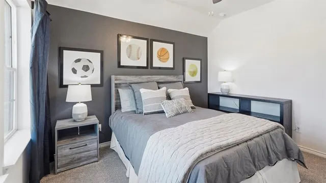 a bedroom with a bed and wall painting