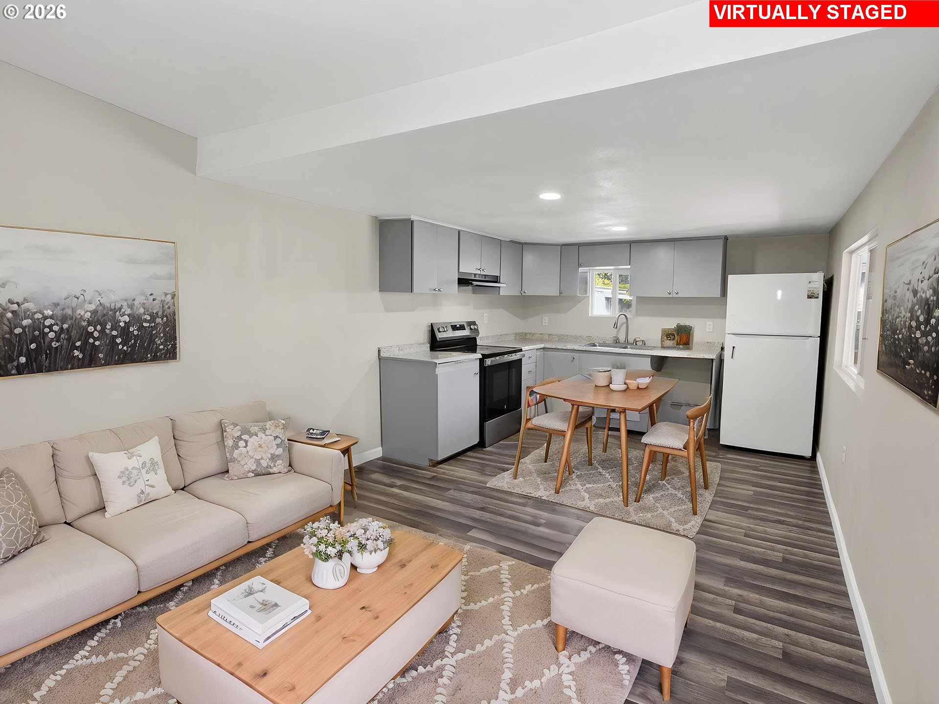 10405 Southwest Denney Road, Unit 31 Beaverton, OR 97008 - Photo 13 of 44 a living room with a couch and a dining table with kitchen view