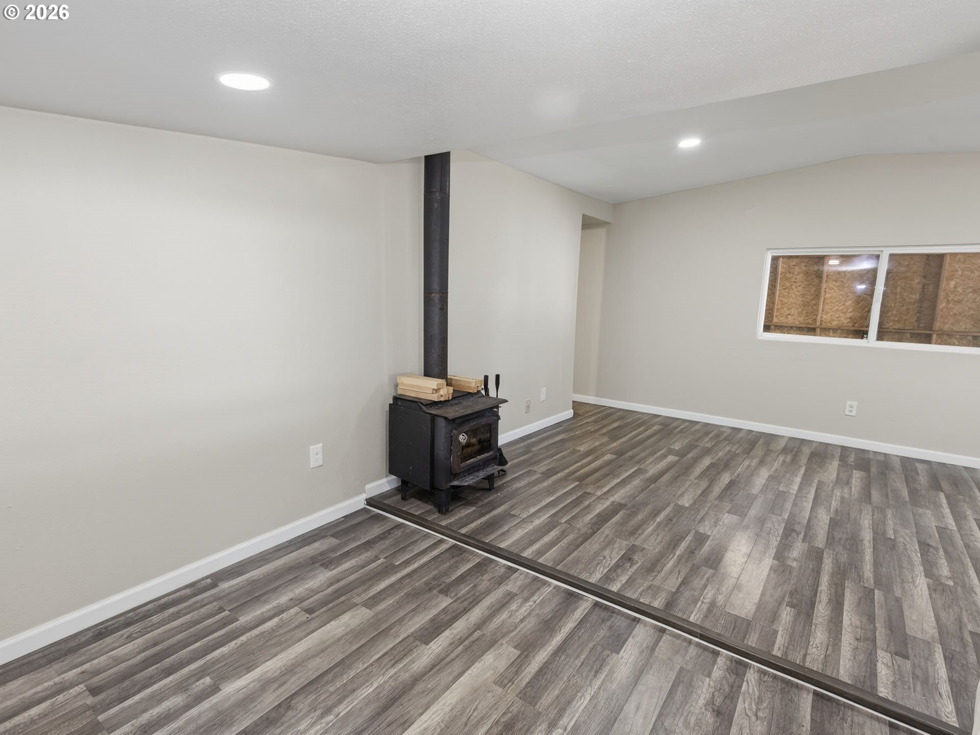 10405 Southwest Denney Road, Unit 31 Beaverton, OR 97008 - Photo 16 of 44 a view of a room with wooden floor