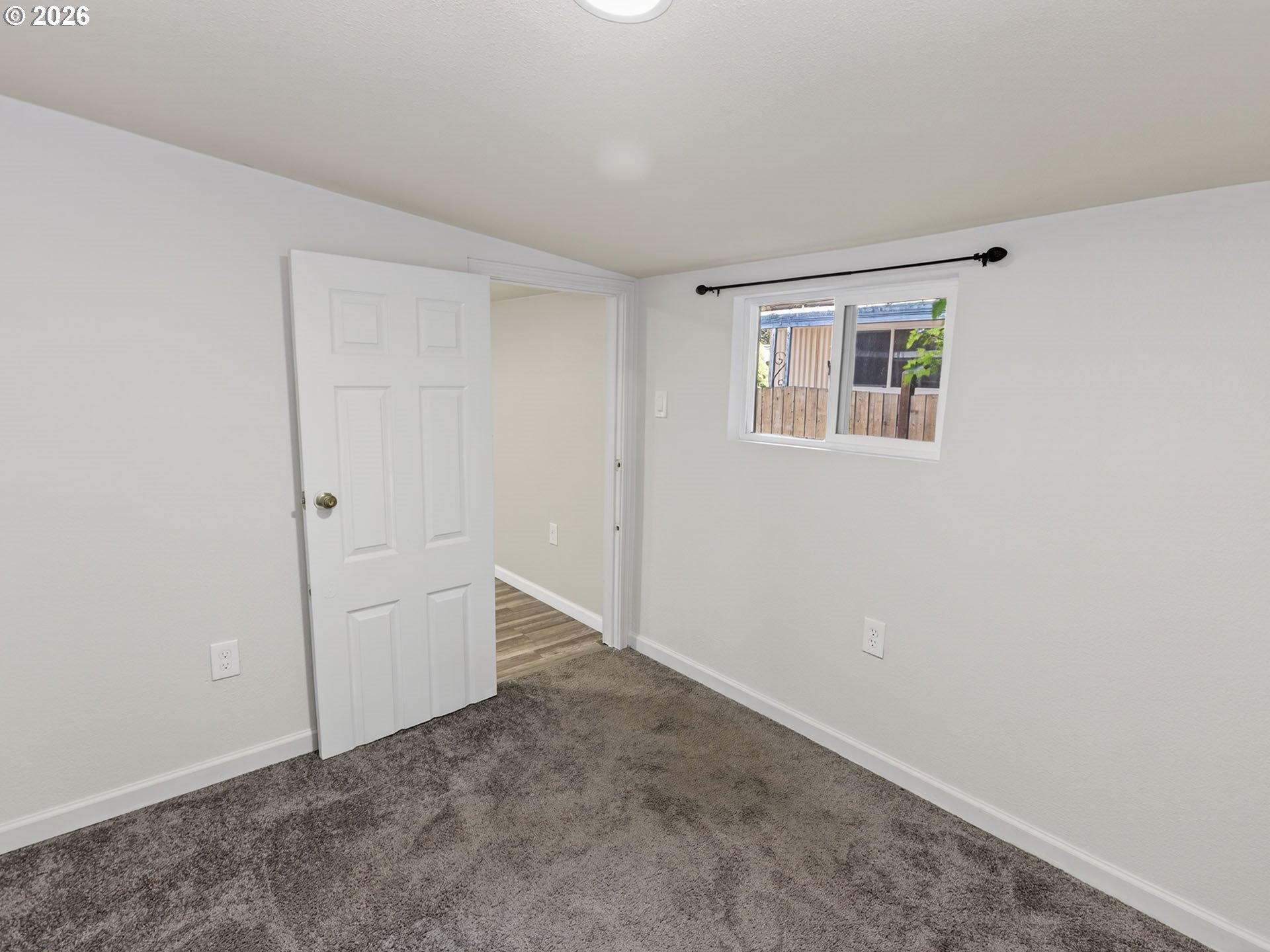 10405 Southwest Denney Road, Unit 31 Beaverton, OR 97008 - Photo 18 of 44 an empty room with windows