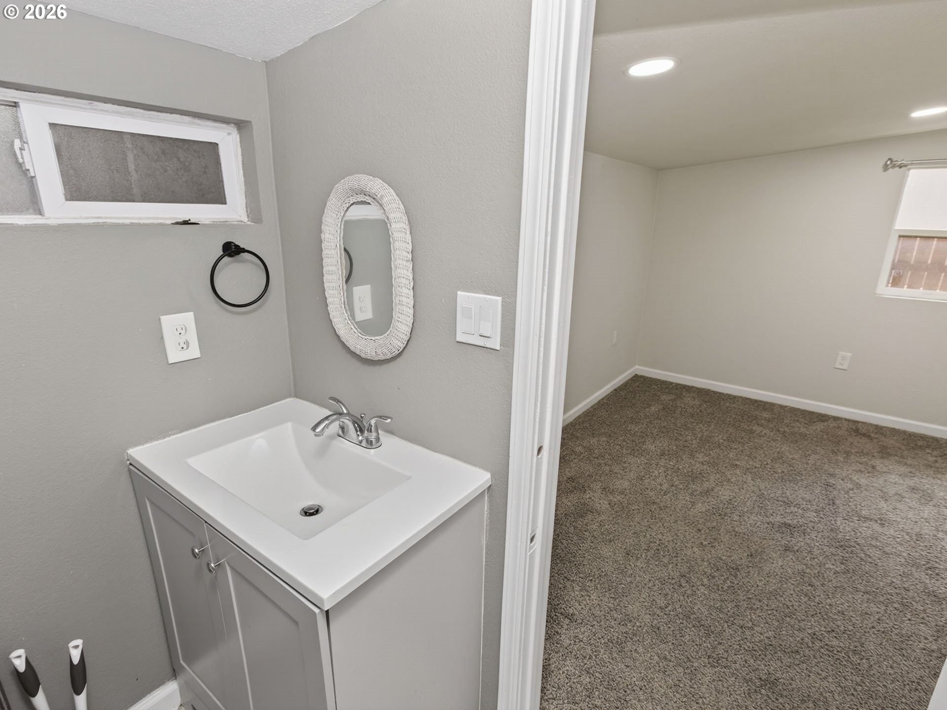 10405 Southwest Denney Road, Unit 31 Beaverton, OR 97008 - Photo 35 of 44 a bathroom with a sink and a mirror