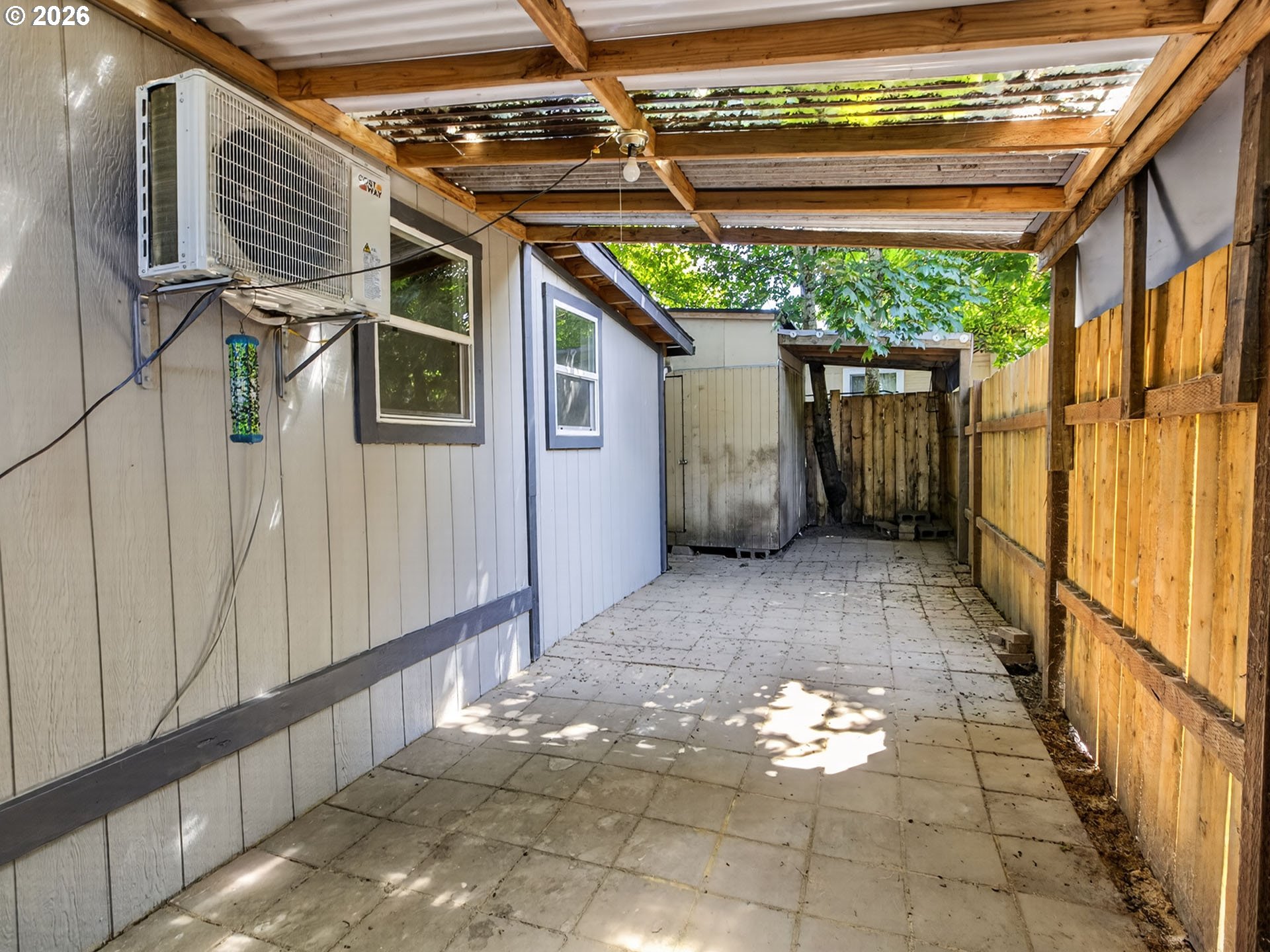 10405 Southwest Denney Road, Unit 31 Beaverton, OR 97008 - Photo 39 of 44 a view of a porch with a hanging chair