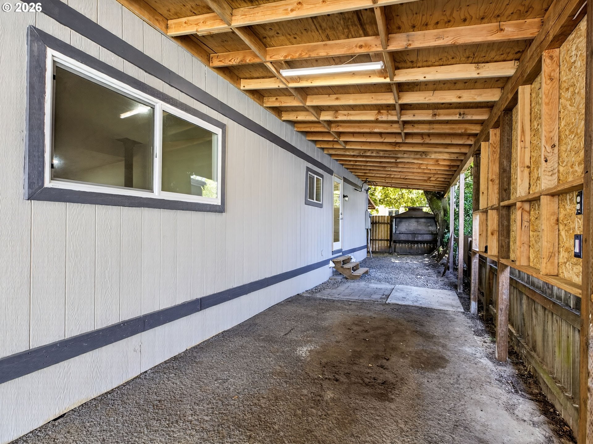 10405 Southwest Denney Road, Unit 31 Beaverton, OR 97008 - Photo 41 of 44 a view of an empty room with wooden roof