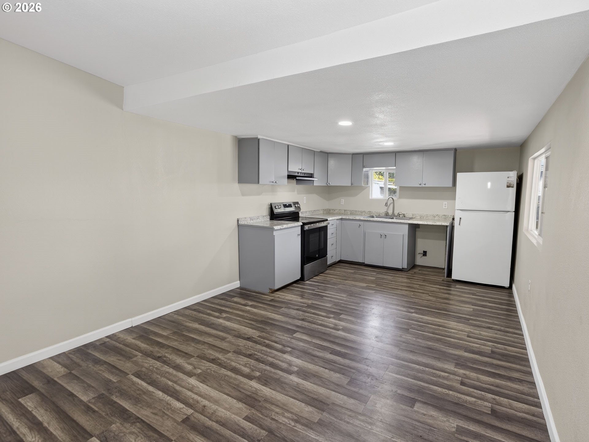 10405 Southwest Denney Road, Unit 31 Beaverton, OR 97008 - Photo 8 of 44 a kitchen with a refrigerator and a sink