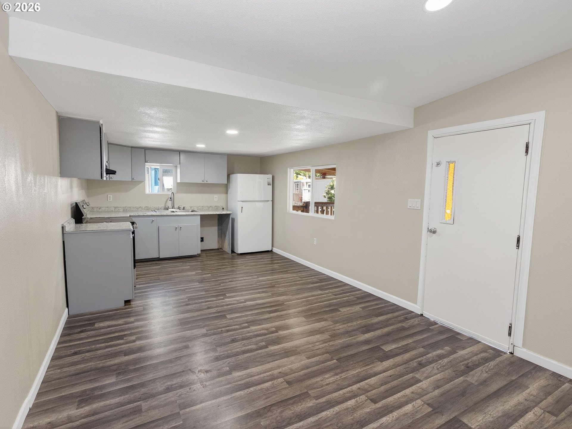 10405 Southwest Denney Road, Unit 31 Beaverton, OR 97008 - Photo 9 of 44 a view of kitchen and wooden floor