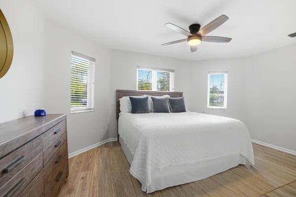 a bedroom with a bed and a dresser