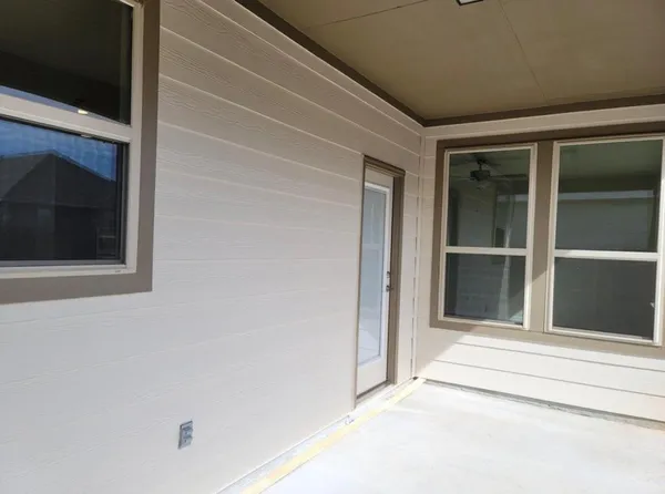 a view of a house with a backyard