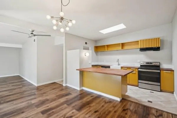 a kitchen with a stove and a sink