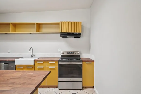 a view of a room with wooden floor and white walls