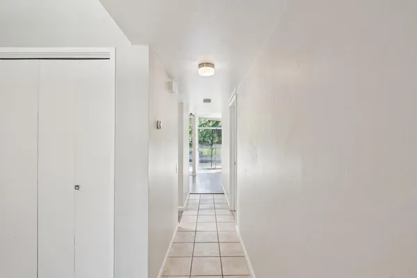 a view of a yard with wooden fence