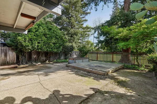 an aerial view of a house with a garden
