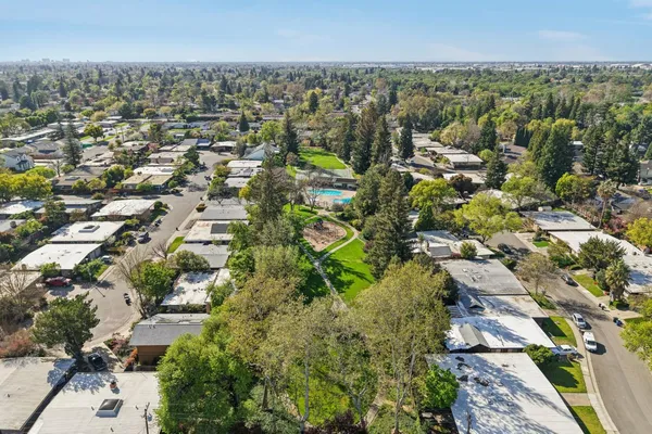 a view of outdoor space with deck and trees