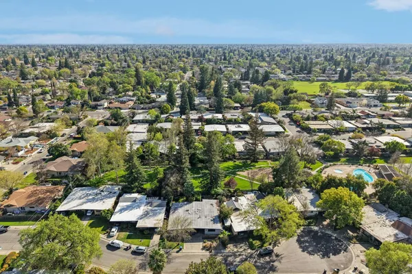 a view of a swimming pool and a yard