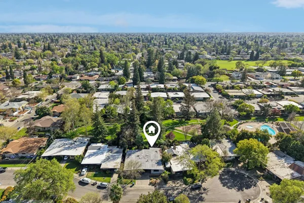 a view of a swimming pool with a patio