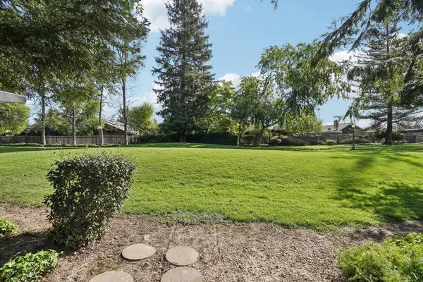 a view of a playground with basketball court