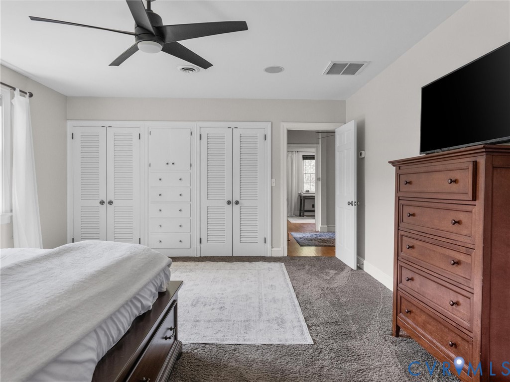 13099 Cedon Road Ashland, VA 23005 - Photo 36 of 92 Spacious primary is carpeted, has a ceiling fan, b