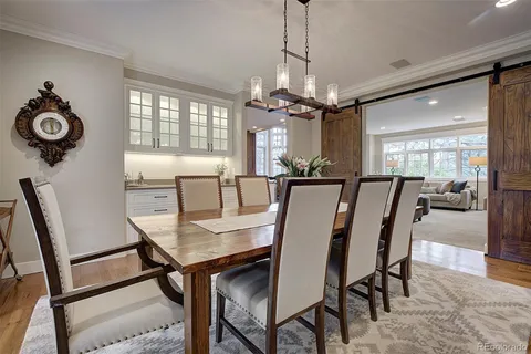 a view of a dining room with furniture window and chandelier