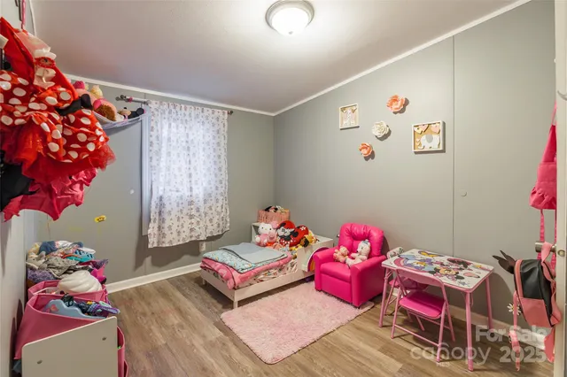 a bedroom with baby toys and a couch