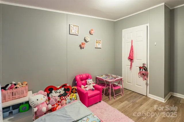 a bedroom with toys and a couch