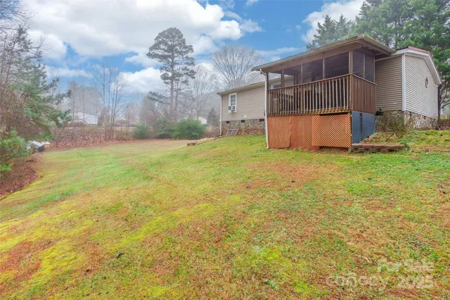 a front view of a house with a yard and a garage