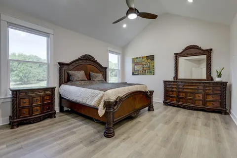 a bedroom with a bed and a dresser