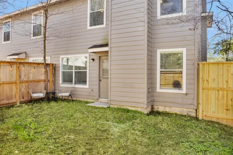 a view of front door of house with yard