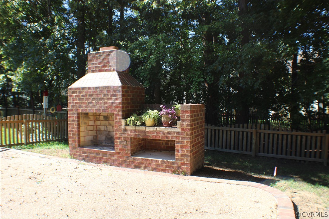 8530 Easton Ridge Place Chesterfield, VA 23832 - Photo 3 of 36 Expansive aggregate patio with brick fireplace, de