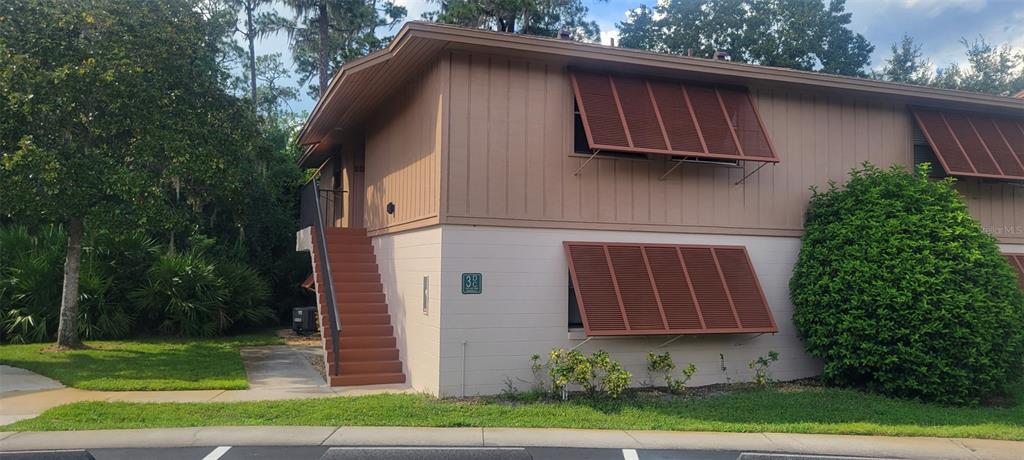 160 Live Oak Woods Court, Unit 3C Deltona, FL 32725 - Photo 1 of 19 a backyard of a house with lots of green space