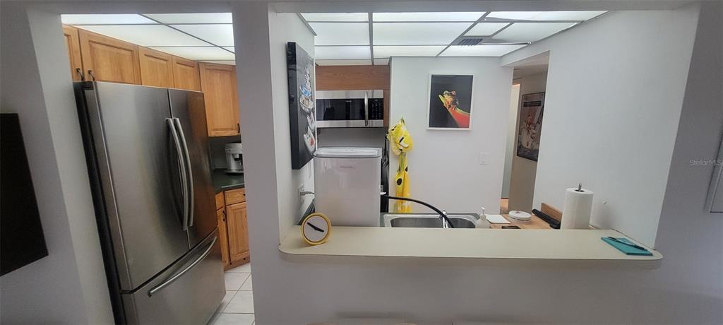 160 Live Oak Woods Court, Unit 3C Deltona, FL 32725 - Photo 4 of 19 a view of a refrigerator in kitchen