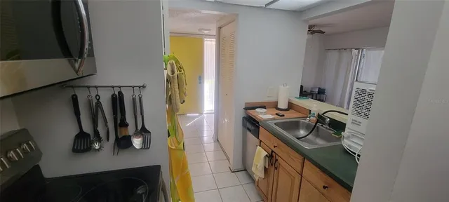 a kitchen with a stove and a refrigerator