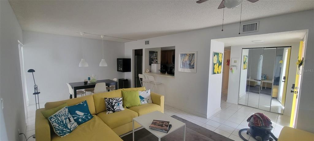 160 Live Oak Woods Court, Unit 3C Deltona, FL 32725 - Photo 8 of 19 a living room with furniture and a table